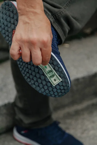 Banknote stuck to sole — Stock Photo, Image