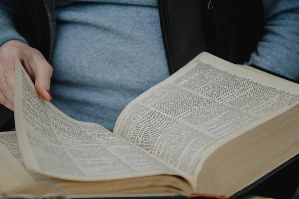 Thick book in hands of man — Stock Photo, Image