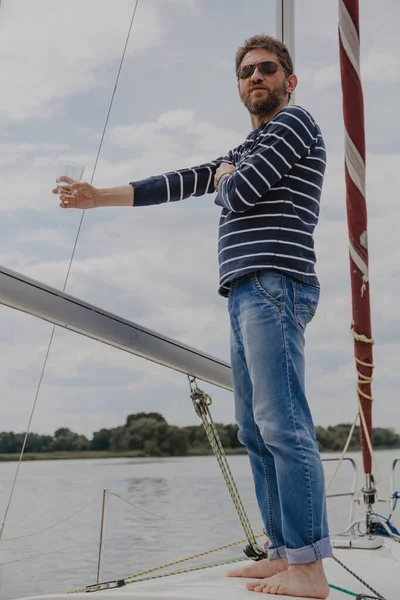 Businessman Beard Striped Sweater Stands Nose White Yacht Drinks Whiskey — Stock Photo, Image