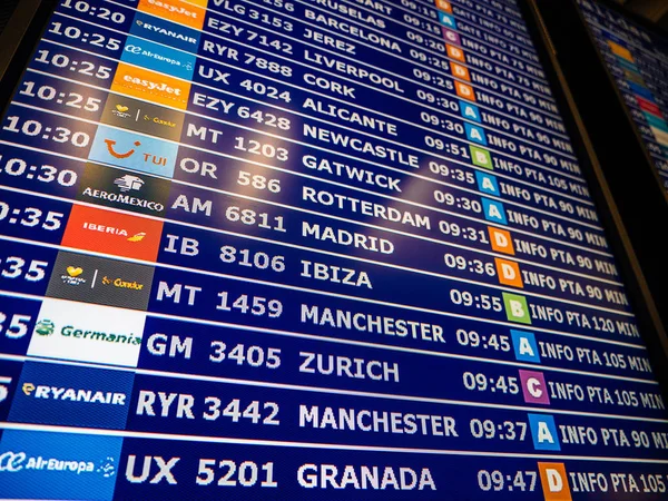 Airport information board close-up in modern Spanish Europe Airp — Stock Photo, Image
