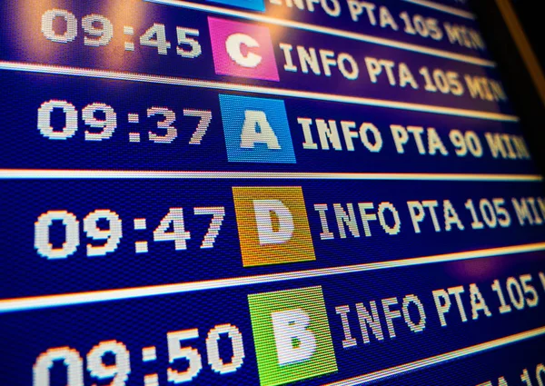 Modern airport information board with diverse gates — Stock Photo, Image