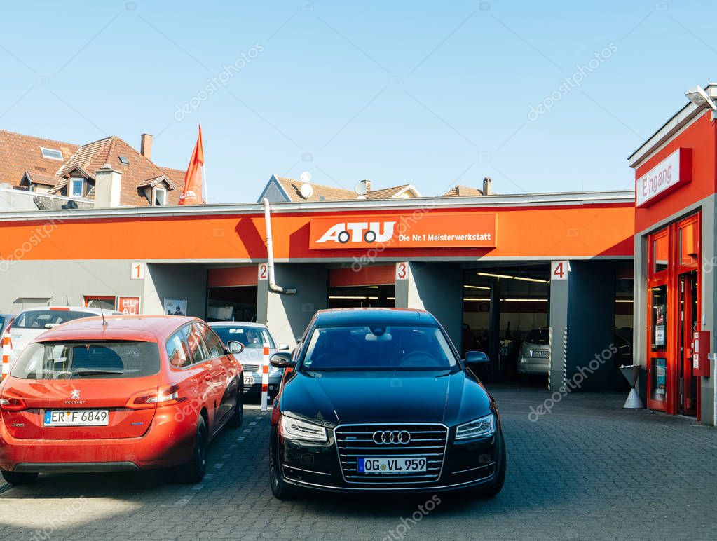 FRANKFURT, GERMANY - APR 17, 2018: Audi and Peugeot car in front of the Auto-Teile-Unger car service