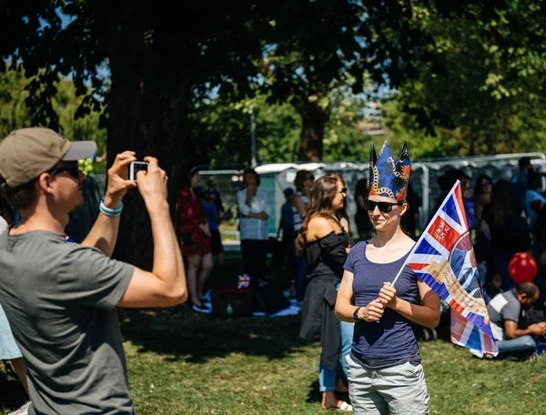 Royal Wedding atmosphere in Windsor woman taking photo flag — Stock Photo, Image