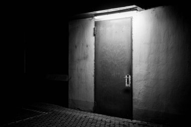 Door iluminated in the night clipart