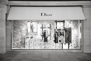 LONDON, UNITED KINGDOM - MAY 18, 2018: Congratulation message from Christian Dior fashion boutique to  HRH Prince Harry of Wales KCVO and Ms Meghan Markle flagship store on Regent street for Royal Wedding black and white clipart