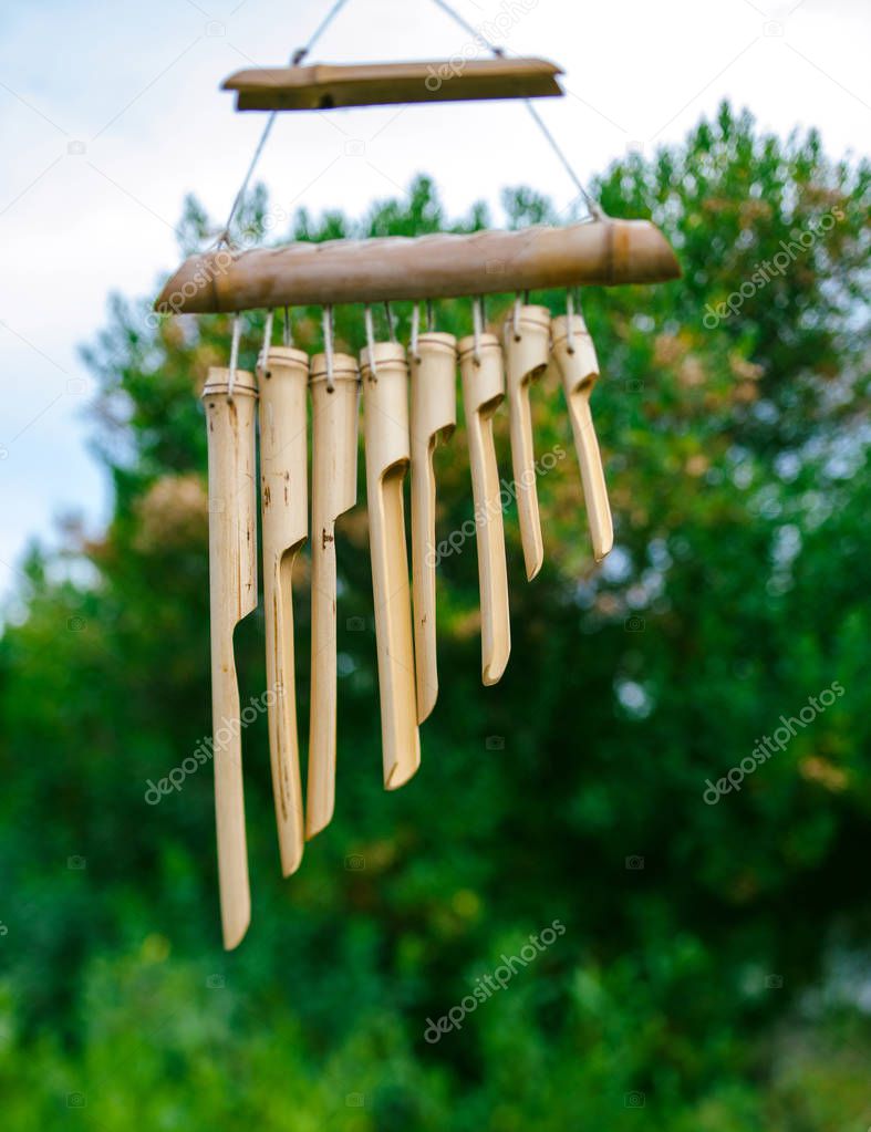 Japanese Bamboo Garden Wind Chimes wooden bells handed on tree in Japanese garden
