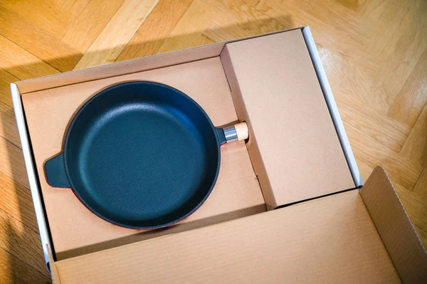 Unboxing Modernprofessional Black Fry Pan Kitchen Parquet Wooden Background View — Stock Photo, Image