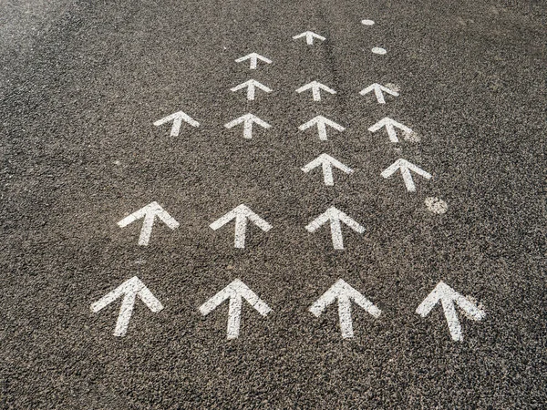 Arrow white marking on asphalt — Stock Photo, Image