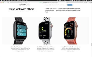 London, Büyük Britanya - 12 Eylül 2018: Şafak Devriyesi Nike eğitim kulüp apps spor bilgisayar Macbook ekran üzerinde görülen Apple Watch giyilebilir bilgisayar üzerinde 