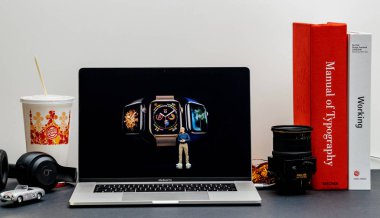 London, United Kingdom - September 13, 2018: Apple Computers internet website on 15 inch 2018 MacBook Retina in room environment showcasing Keynote in Cupertino Tim Cook and Apple Watch series 4 clipart