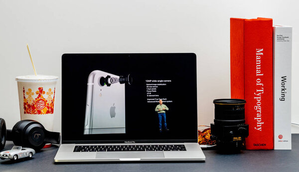 London - September 13, 2018: Apple Computers internet website on 15 inch 2018 MacBook Retina in room environment showcasing iPhone Xs Max R Keynote in Cupertino camera specs Phil Schiller