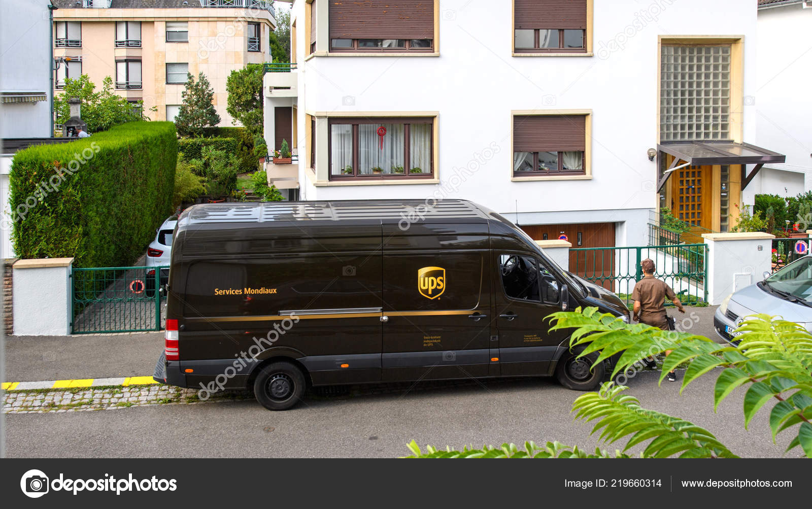 UPS fast delivery worldwide brown van Stock Editorial Photo