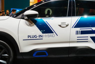 PARIS, FRANCE - OCT 4, 2018: Plug-in hybrid sign on new electric plug in Citroen SUV c5 Aircross hybrid at International car exhibition Mondial Paris Motor Show clipart