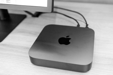 PARIS, FRANCE - NOV 7, 2018: Hero object of new Apple Mac Mini computer with the new processor cpu, 64 DDR4 RAM and 10 Gigabit Ethernet port black and whtie  clipart