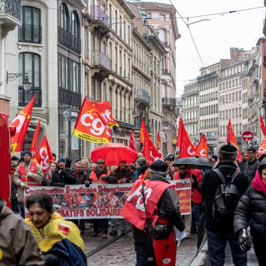 STRASBOURG, FRANCE - MAR 22, 2018: CGT General Confederation of Labour workers with placard at demonstration protest against Macron French government string of reforms - central street demonstration clipart