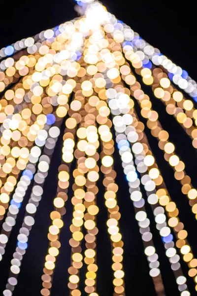 Vertical Abstract defocused bokeh illuminated garland view from