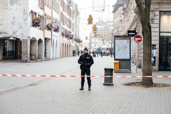 Police officer surveilling Strasbourg murder by terrorist zone