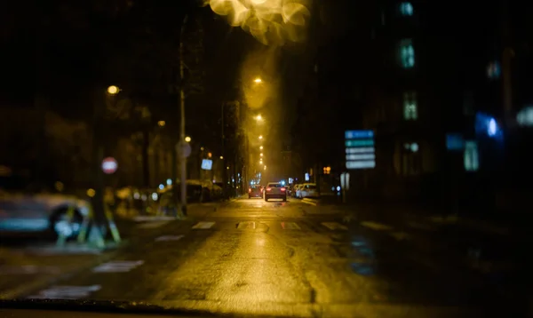 Driver pov tilt-shift lens road street driving night