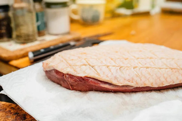 Kitchen counter table with duck filet grid cut — Stock Photo, Image