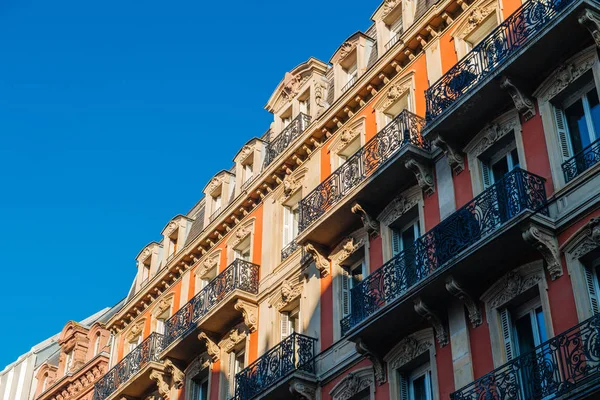 French Haussmannian apartment building with clear blue sky