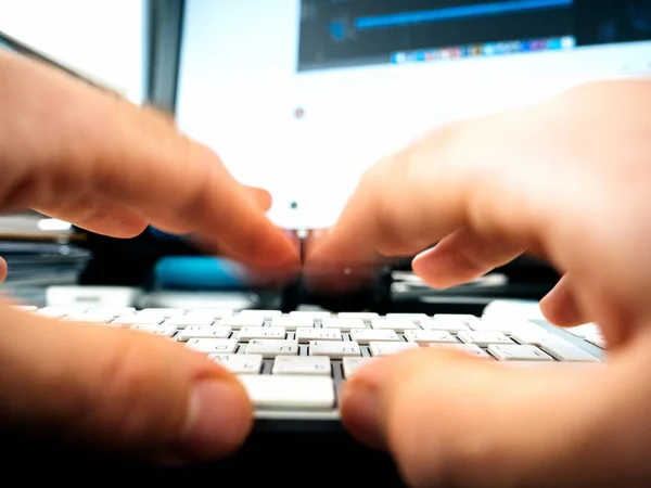 Male hands working on computer keyboard writing playing — Stock Photo, Image
