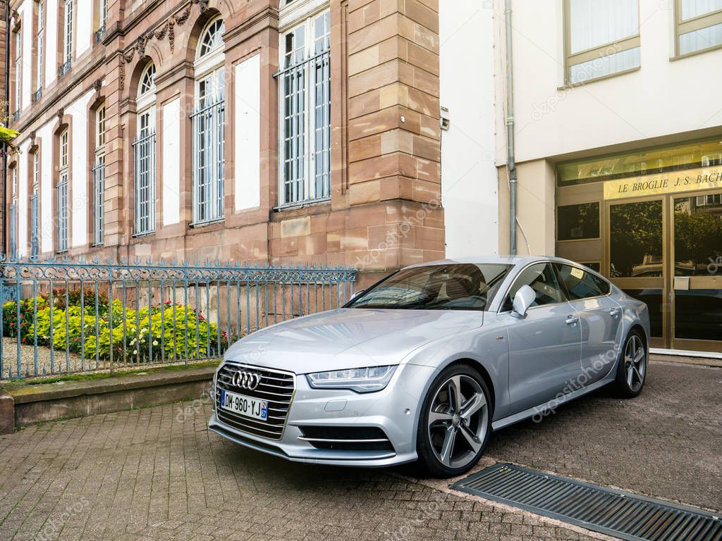 Strasbourg, France - Oct 1, 2017: Front side view of ilver luxury Audi A8 vehicle parked in an upper-class neighbourhood in Strasbourg, France in Place Broglie near city hall
