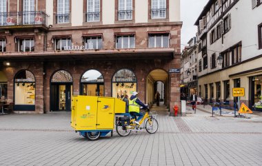La Poste courier delivery riding electric bike clipart