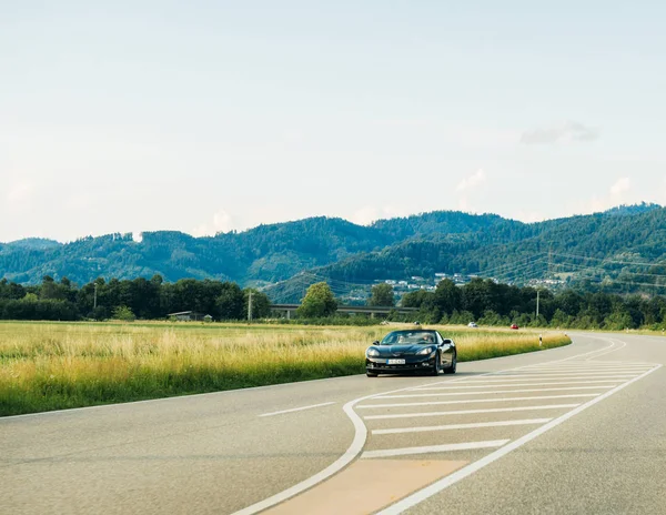German highway with luxury Mustang convertible