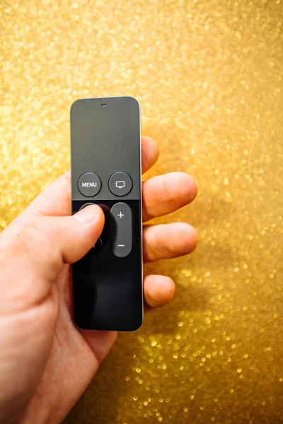 Apple TV Plus remote control sparkle background — Stock Photo, Image