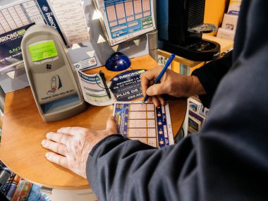 Senior man fill lottery ticket euromillions in tabak press kiosk  clipart