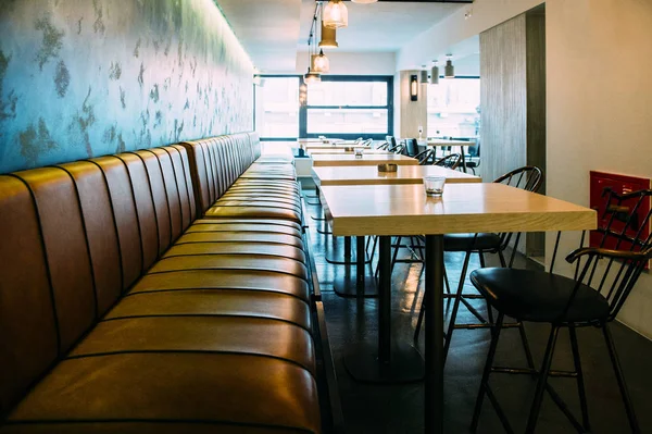 Empty cafe with large leather chair sofa — Stock Photo, Image