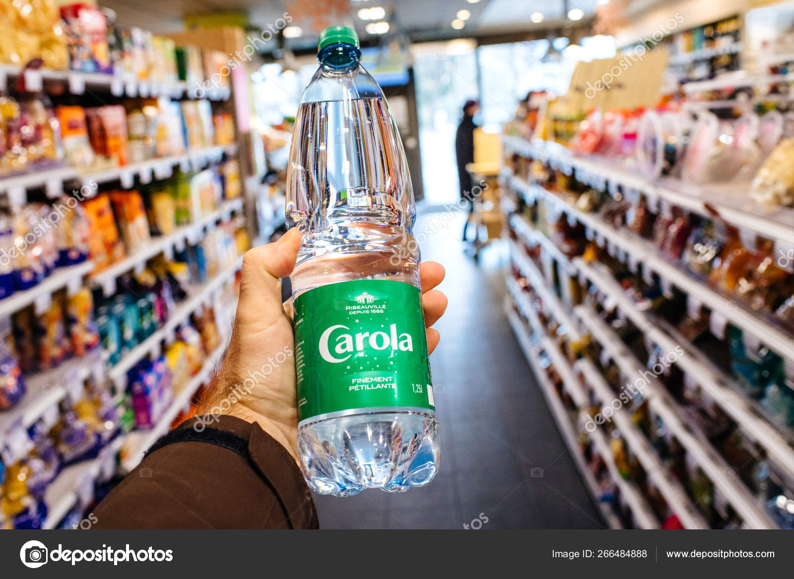 Holding Carola Mineral Water In Modern Supermarket Stock Editorial Photo C Ifeelstock 266484888