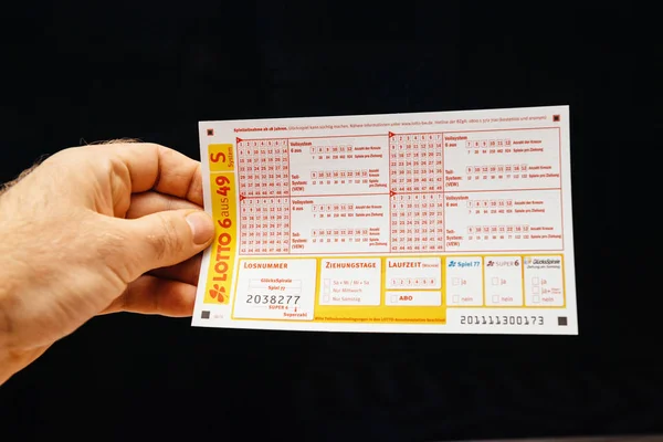 LOTTO 6 from 49 ticket in male hand — Stock Photo, Image