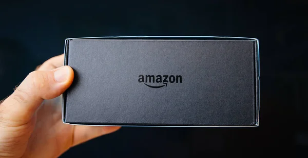 Amazon Logotype on the cardboard box of Alexa Echo Spot — Stock Photo, Image