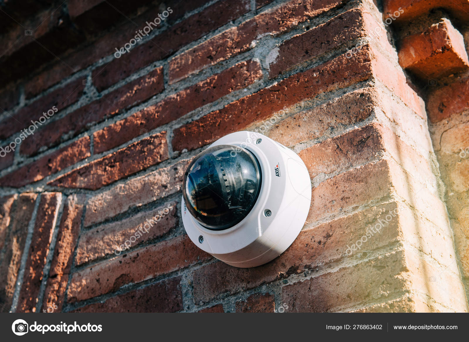 Axis 360 degrees surveillance camera on brick wall Stock Editorial