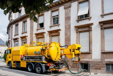 professional modern yellow sewage sewerage truck clipart