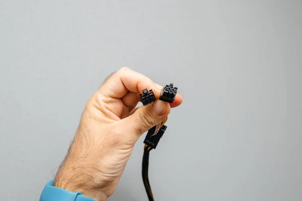 Man hand hålla nya data Power hand isolerad på grå broderiets — Stockfoto