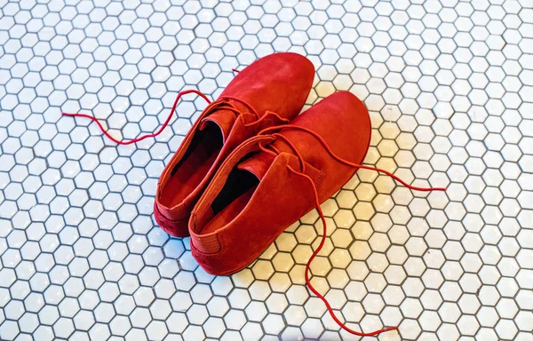 Modern beautiful red shoes with red laces — Stock Photo, Image