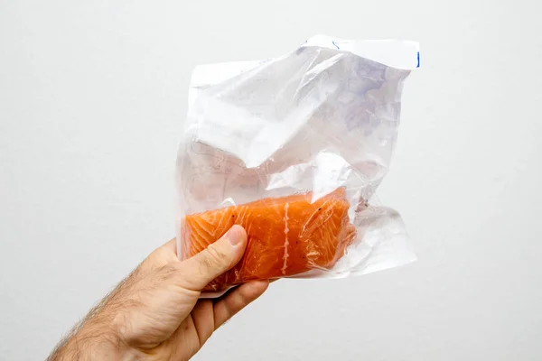 Plastic sealed package with fresh salmon steak — Stock Photo, Image