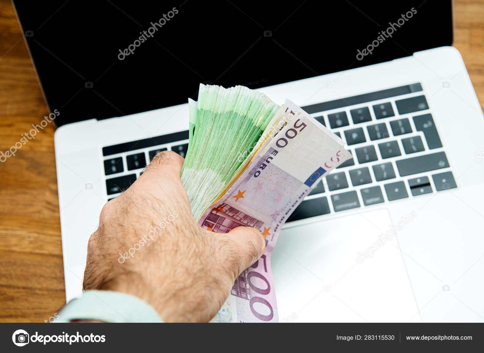 Uitwerpselen been Buitengewoon Man hand holding large stack pile of 500 100 200 Euro Stock Photo by  ©ifeelstock 283115530
