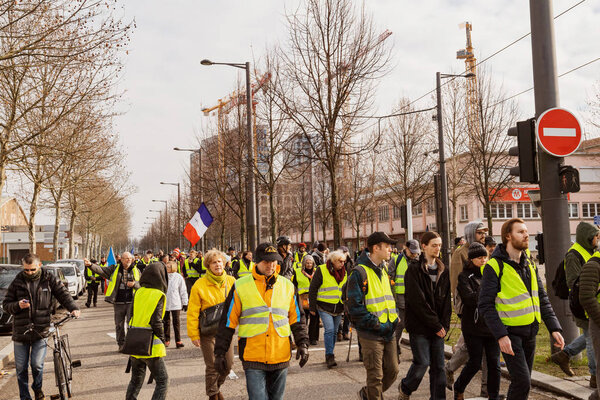 Placard with inscription Macron Demission at yellow vests protest