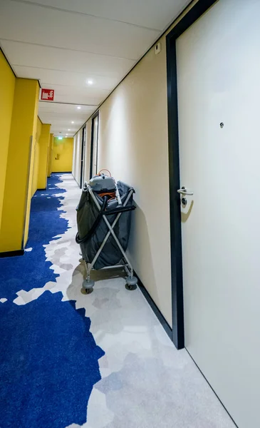 Janitorial cleaning cart near a wall