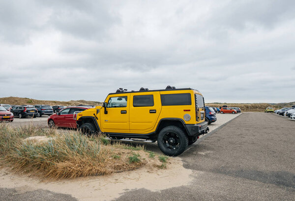 luxury yellow hummer large SUV