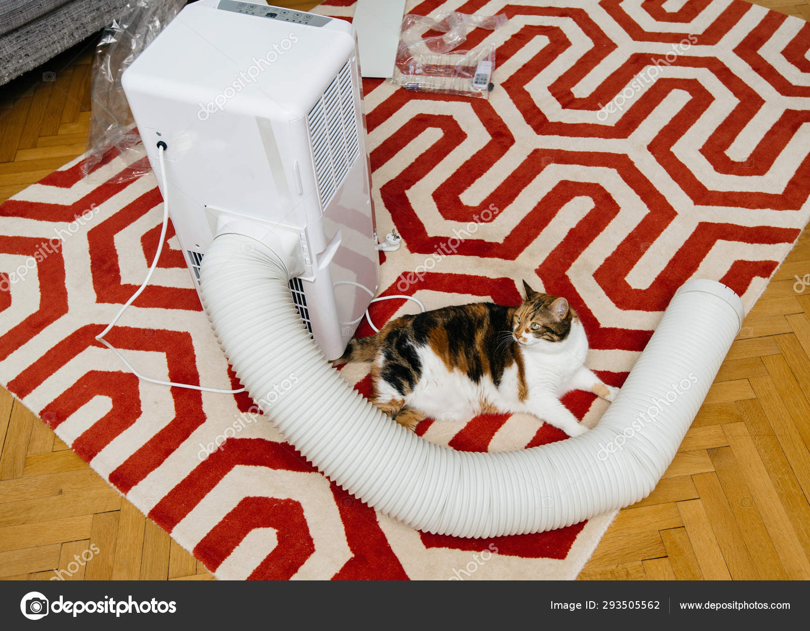 Unboxing of new portable air conditioner unit AC Stock Photo by