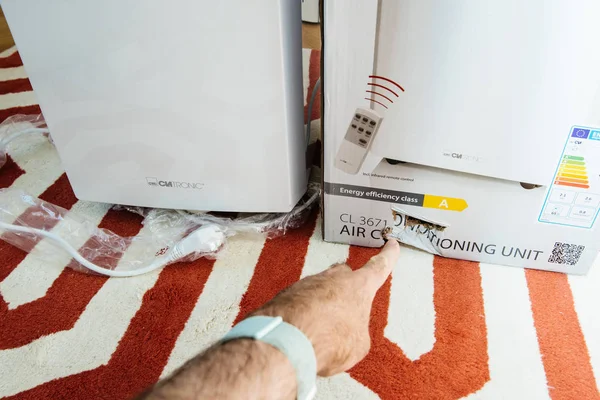 Unboxing of new portable air conditioner unit AC — Stock Photo, Image