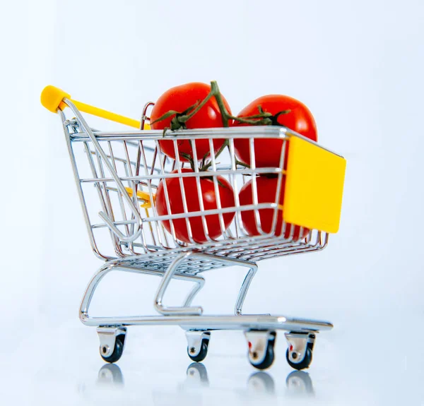 Tomatoes in mini supermarket cart