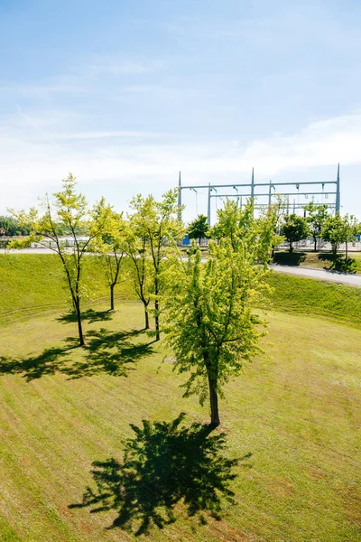 Young green trees with hydroelectric power plant — Stock Photo, Image