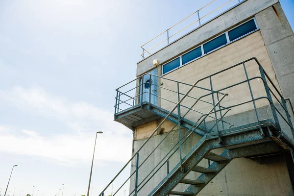 Steel staircase to surveillance building — Stock Photo, Image