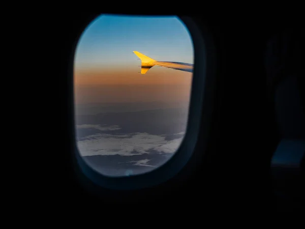 View through airplane window of aircraft wing — Stock Photo, Image