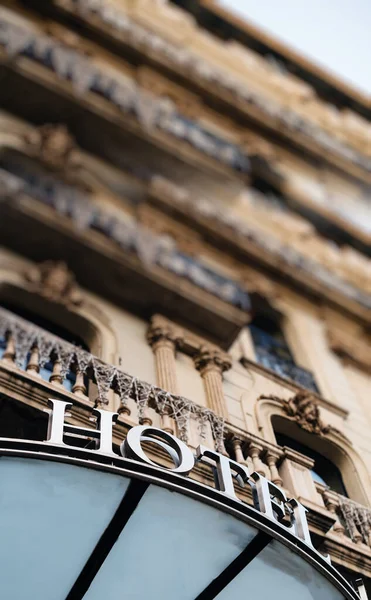 Hotel sign inscription on the facade of the beautiful catalan building — Stock Photo, Image